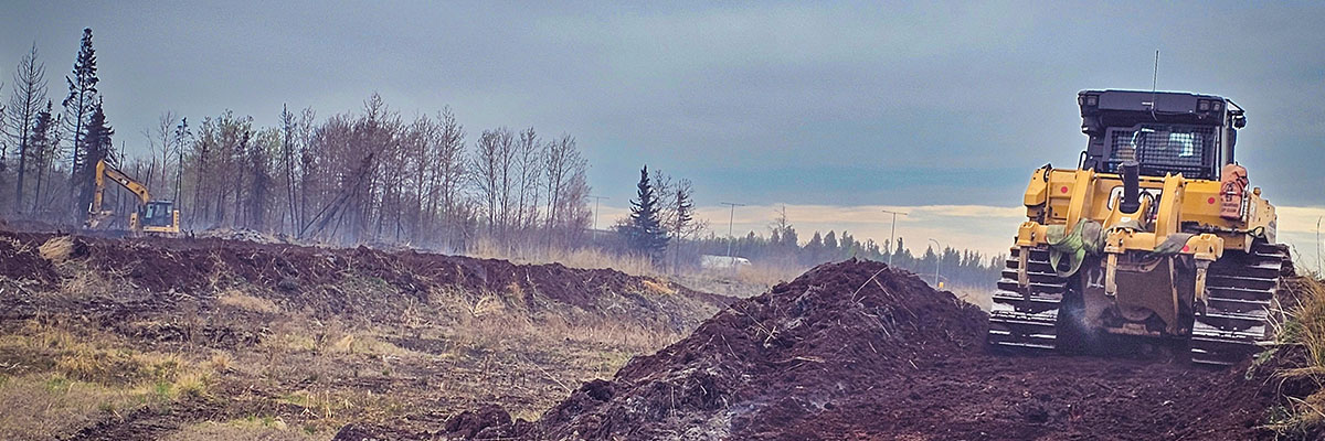 On site photo of Hi-Tower Inc. doing work to help supress a smoldering peat fire off the Anthony Henday in Edmonton.